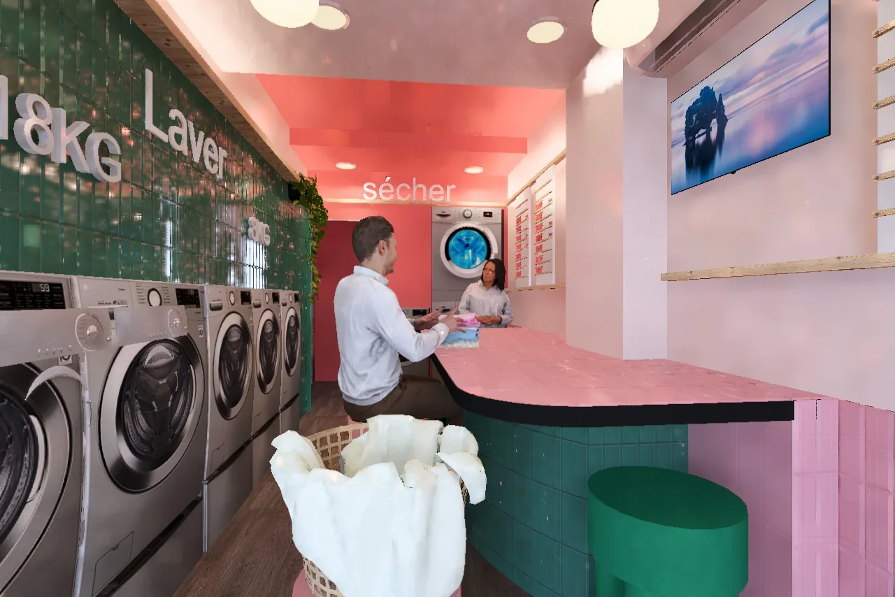 Comptoir rose et rangée de machines à laver devant un mur de carrelage vert, avec un écran mural